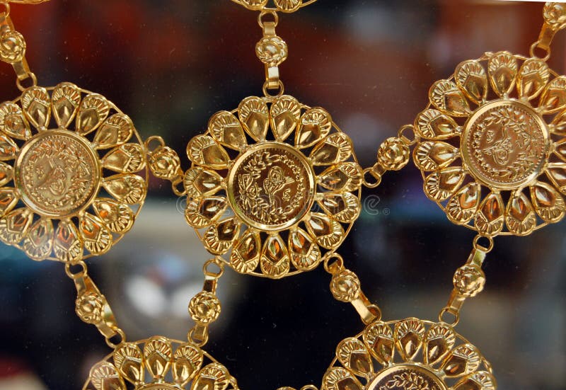 Picture of a Golden necklace with golden coins with arabic letters,ottoman coins