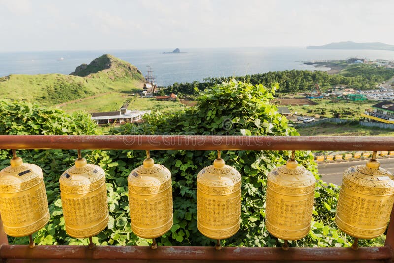 Golden prayer wheels with dragon head at Sanbanggulsa temple, Sanbang-ro, Jeju Island, South Korea stock image Golden prayer wheels with dragon head at Sanbanggulsa temple, Sanbang-ro, Jeju Island, South Korea stock image