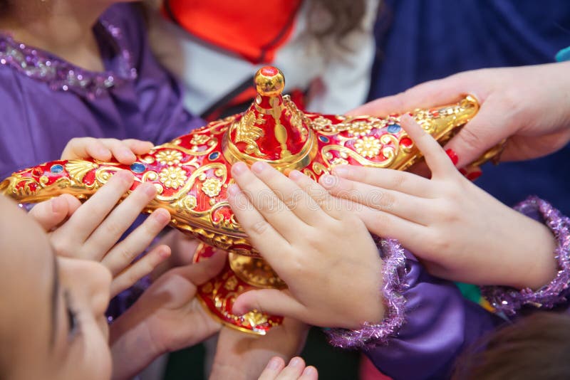 Golden Red Old Magic Lamp . they Touch the Old Magic Lamp with Their