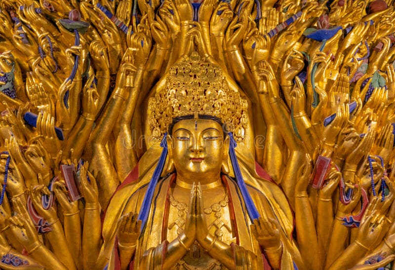 Golden sculpture of Avalokiteshvara Buddha or Guanyin with thousand hands at Dazu Rock Carvings at Mount Baoding or Baodingshan