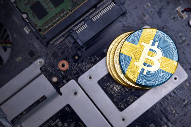 Golden shining bitcoins with flag of sweden on a computer electronic circuit board. bitcoin mining concept