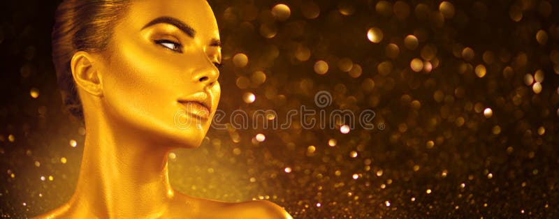 Golden skin make-up, Woman face portrait closeup. Model girl with holiday golden Glamour shiny professional make up