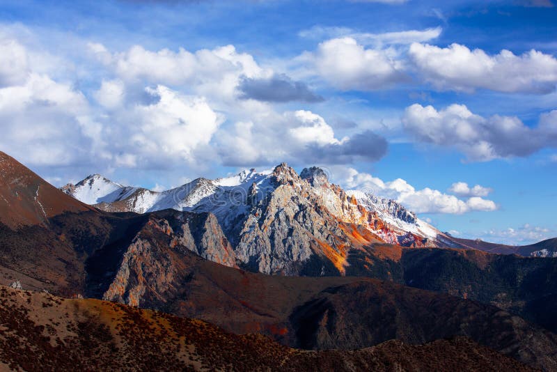 Golden snow-capped mountains in Tibet