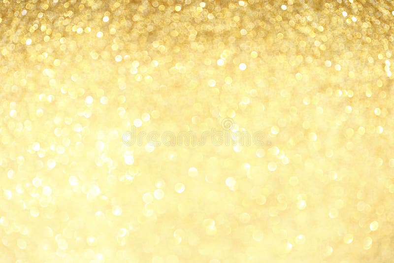 Golden sparkle glitters with bokeh effect and selectieve focus. Festive background with bright gold lights, champagne bubble.