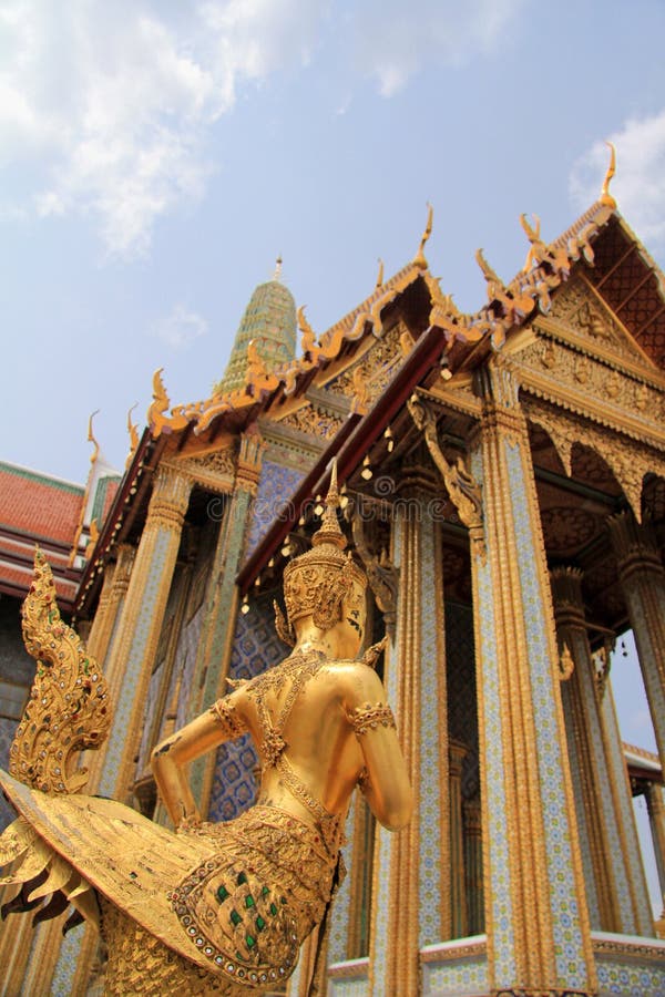 Golden statue of a Kinnara guarding Wat Phra Kaew