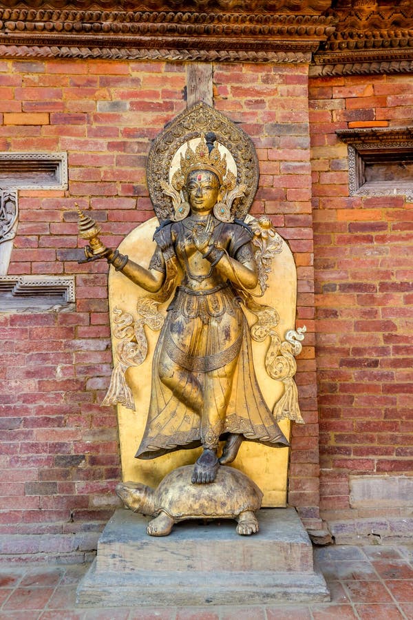 Golden statue of the river goddess Ganga on a tortoise at Mul Chowk, Royal Palace in Patan, Nepal. royalty free stock photos Golden statue of the river goddess Ganga on a tortoise at Mul Chowk, Royal Palace in Patan, Nepal. royalty free stock photos