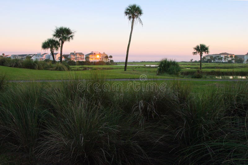 Sunset over a golf course and associated condos. Sunset over a golf course and associated condos