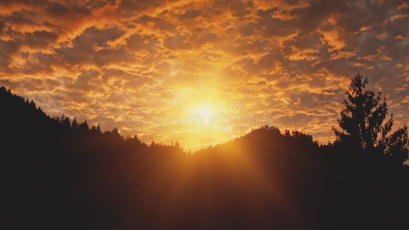 Golden sunset over mountain silhouette aerial. Sun light over mount pine forest. Dark hills and sky