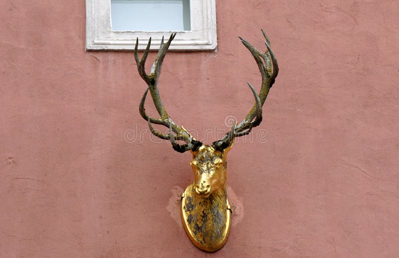 Golden deer on facade stock image. Image of house, golden 164174403