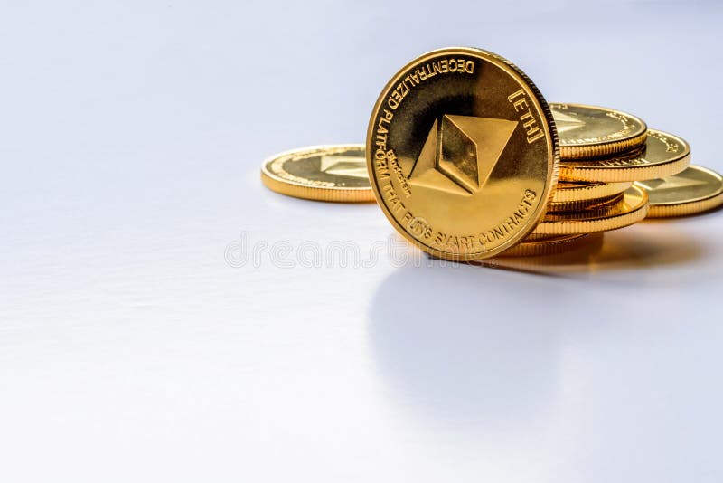 Golden virtual money Ethereum crypto currency coins stacked on bright background royalty free stock photos Golden virtual money Ethereum crypto currency coins stacked on bright background royalty free stock photos