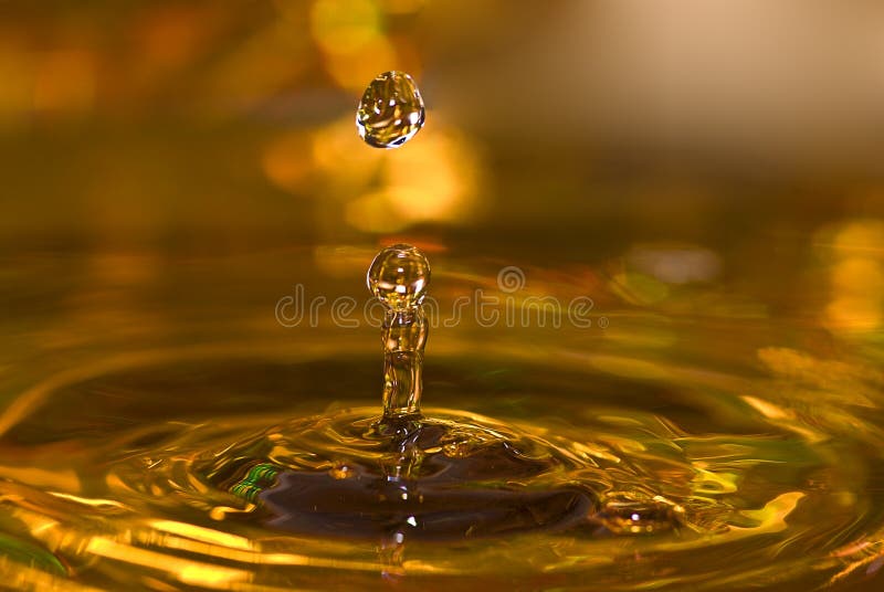 Golden water drops stock image. Image of concepts, colourful 6478745