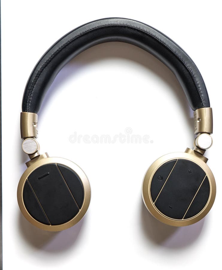 Golden Wireless Headphones on Black Background Isolated Close Up, Luxury Gold Bluetooth Headset