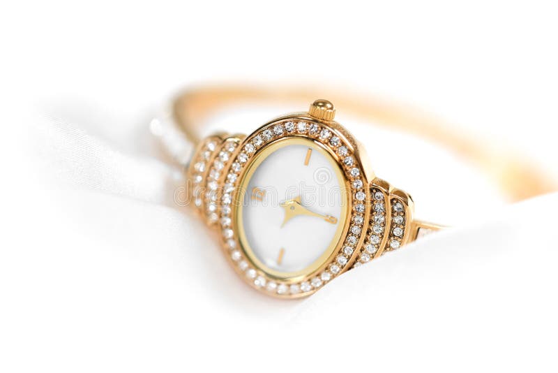 Golden Wrist Watch with White Crystals Wrapped in the White Satin Cloth ...