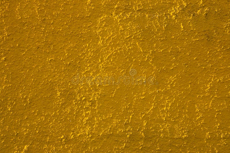 Golden Yellow Colored Abstract Wall Background with Textures of