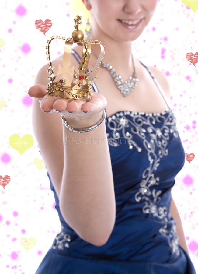 Golden crown of a carnival princess or queen - woman holding a crown in her hands. Golden crown of a carnival princess or queen - woman holding a crown in her hands