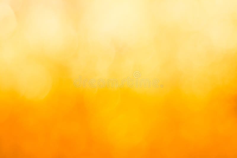 Goldener bokeh Unschärfe-Zusammenfassungshintergrund lizenzfreie stockfotografie