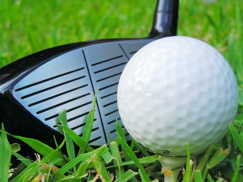 Golf ball on tee with club