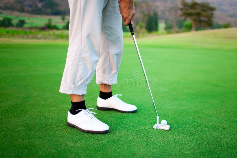 Golfer feet, ball and shoes