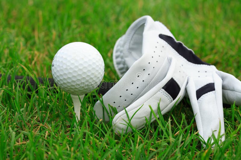 Detail of golf ball and gloves