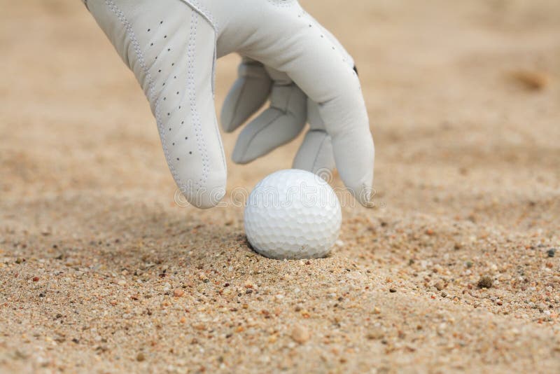 Detail of golf ball and gloves