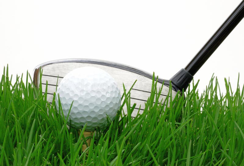 Driver behind a golf ball against at white background