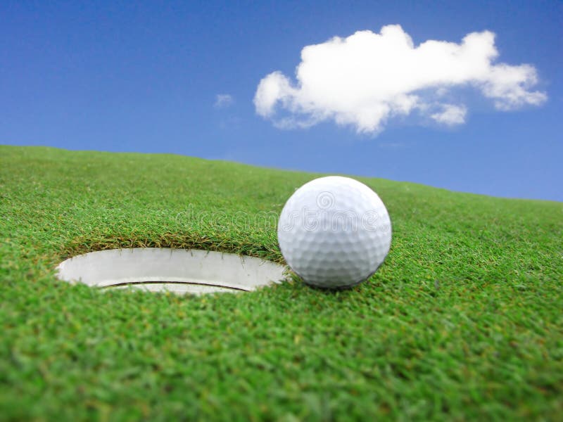 Golf - detail ball with hole on green