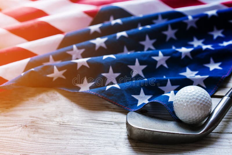 Golf ball with flag of USA on wood table stock photography Golf ball with flag of USA on wood table stock photography