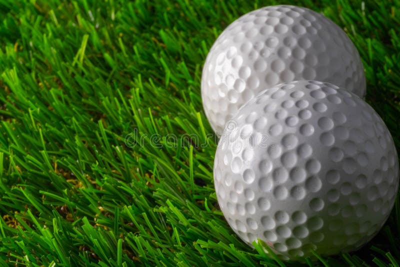 Two golf ball on grass