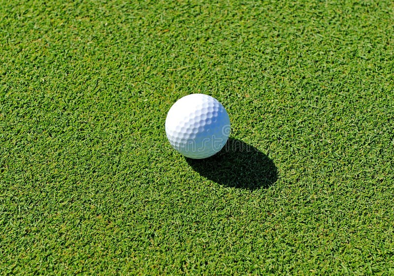 Golf Ball on the Green, Golf Course, Andalusia, Spain Stock Photo