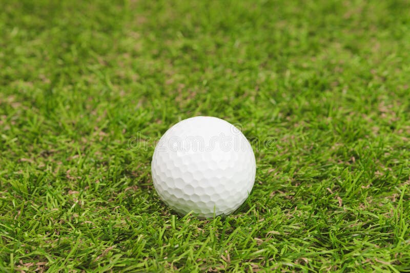 Golf ball on green grass stock photo. Image of single 38596254