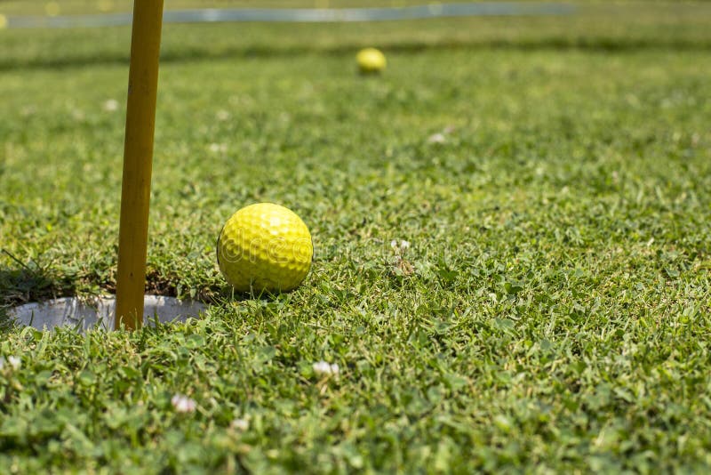 Golf Ball Near the Hole