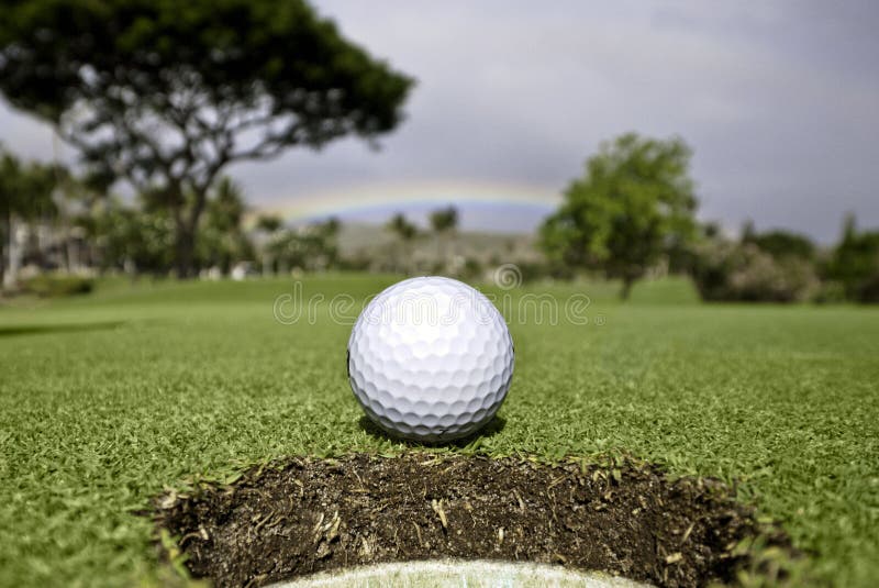 Golf ball next to the hole stock image. Image of sand 22657715