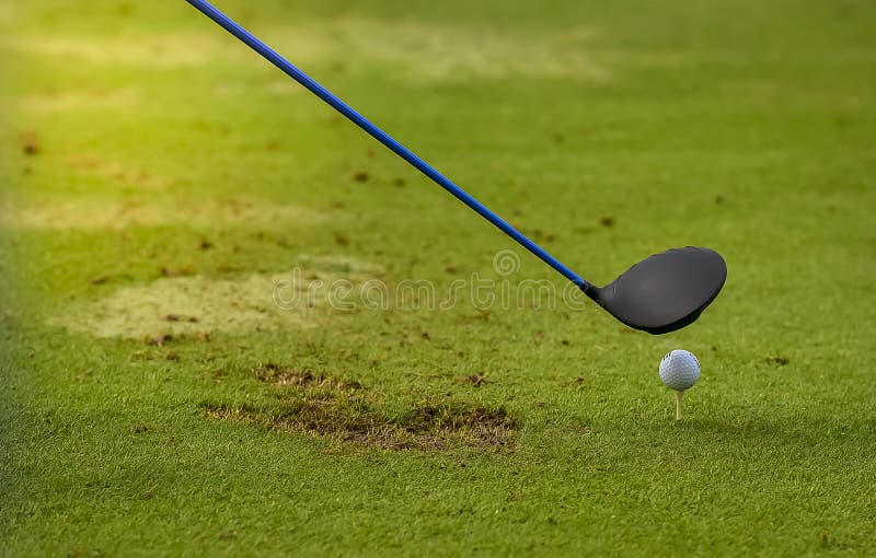 Golf ball putting on sand near hole golf to win in game at golf course with blur background and sunlight ray stock images Golf ball putting on sand near hole golf to win in game at golf course with blur background and sunlight ray stock images