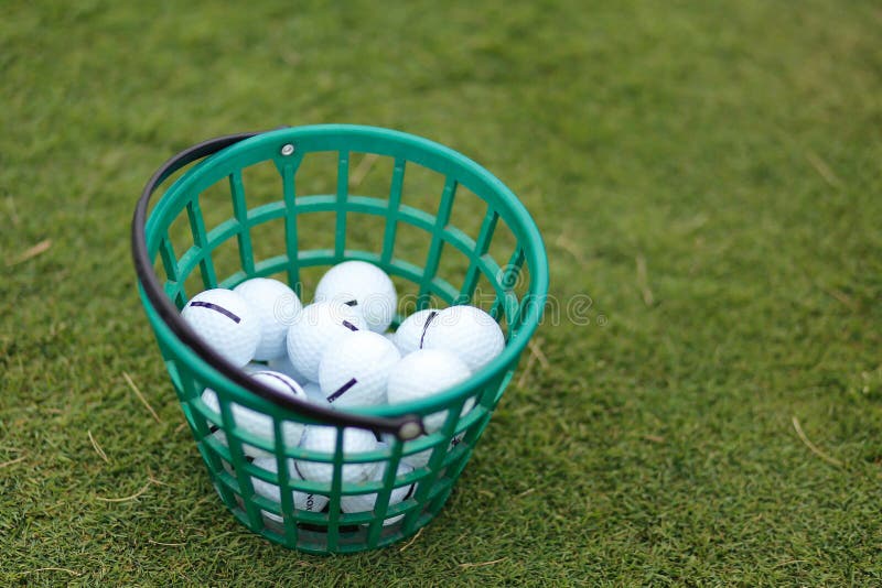 Golf Balls in the Basket on a Grass Background Stock Image - Image of