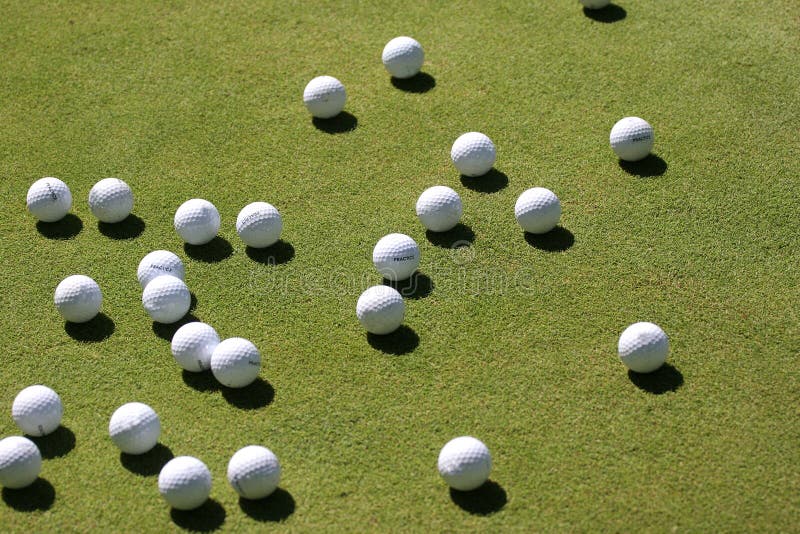 Golf balls on the green stock photo. Image of holidays 3015010