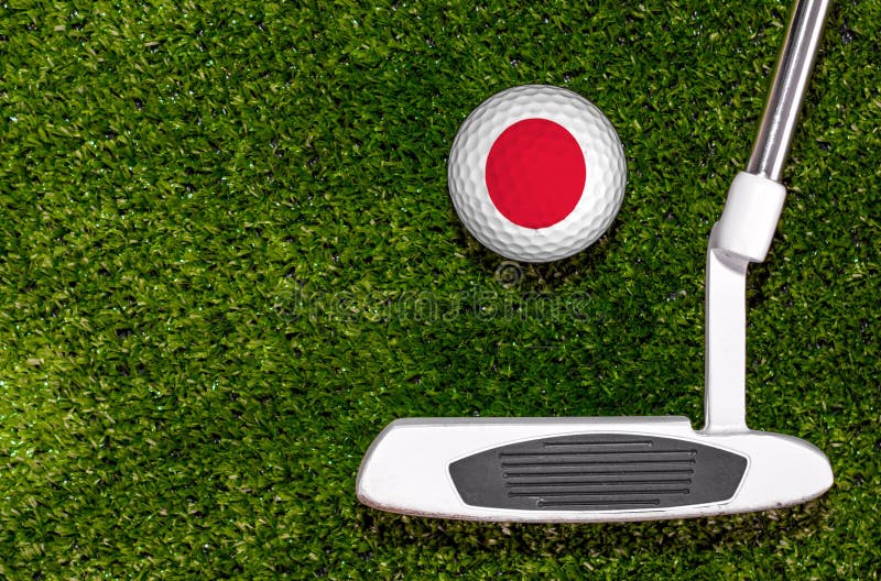 A Golf Club and a Ball with Flag Japan during a Golf Game Stock Photo