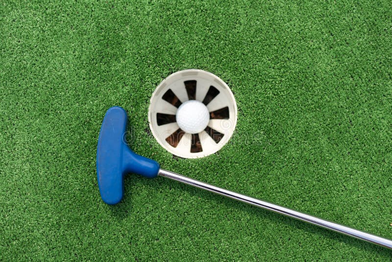 Golf club, ball and hole stock photo. Image of shot 282340112
