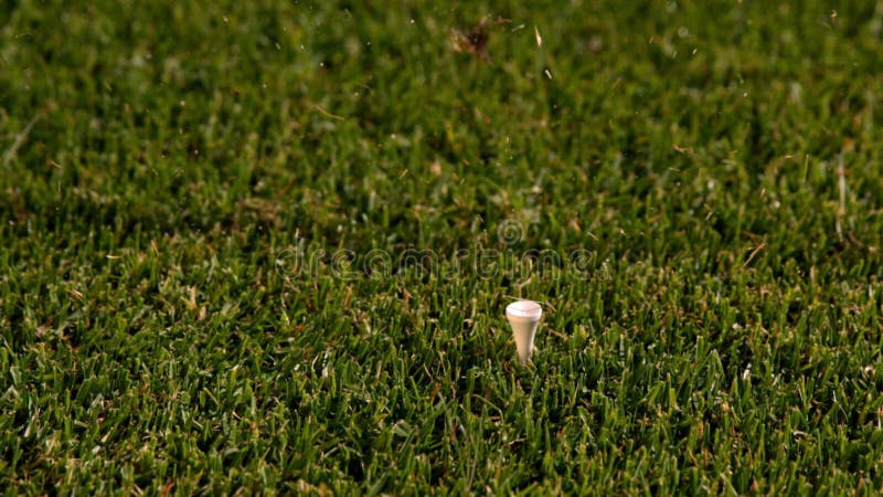 Golf club hitting ball off the tee