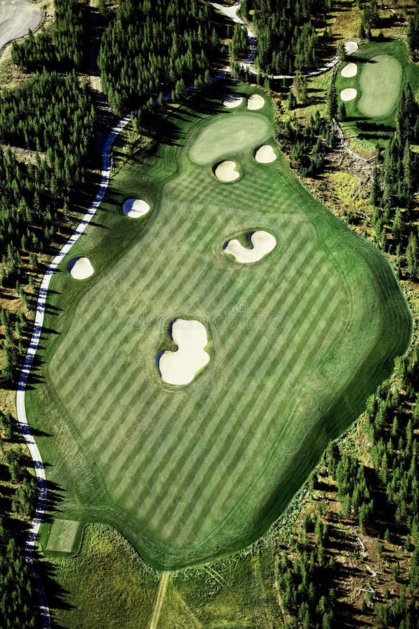 An Aerial View of a Fairway, Green and Sand Bunkers on a Golf Course