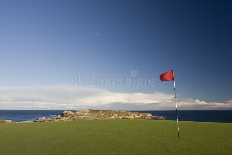 Golf course and putting greens in late afternoon light. Botany Bay National Park. Golf course and putting greens in late afternoon light. Botany Bay National Park.