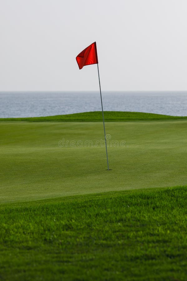 Golf Course with Green Grass and Red Pin Flag Stock Photo Image of