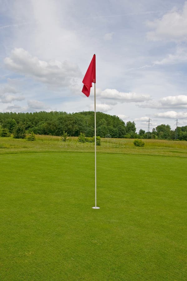 Golf field with red flag stock image. Image of field 136280699