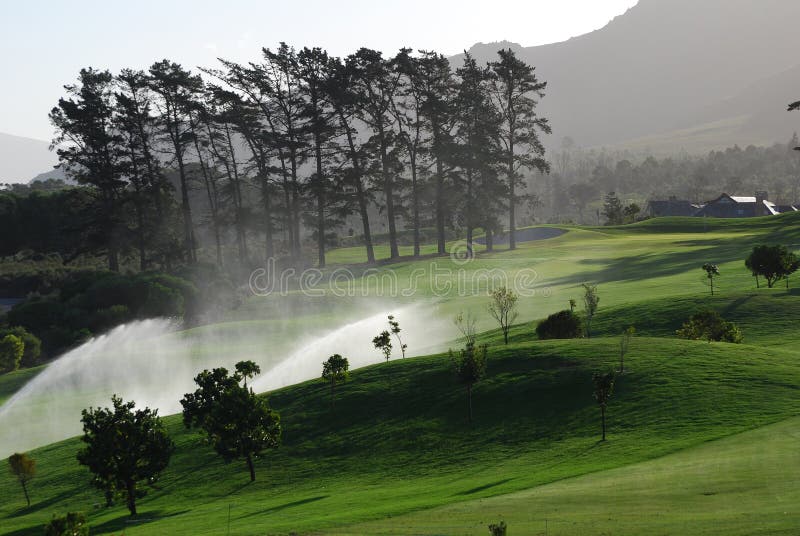 Golf Course Fairway With Irrigation. Stock Photo Image of irrigation, grass 11894934