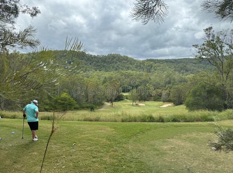 Golf in the jungle with green forest with many trees at Australia with golfer