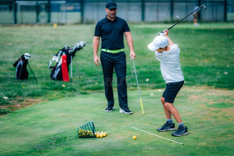 Golf â€“ Personal Training. Golf Instructor Teaching Young Boy How To