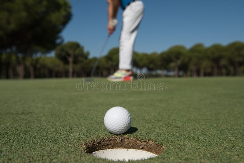 Golf Player Hitting Shot, Ball on Edge of Hole Stock Image Image of