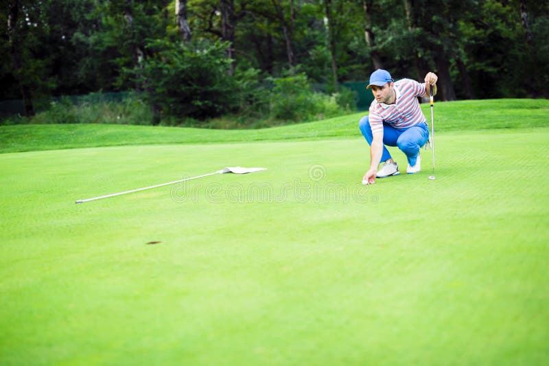 Golf Player Marking Ball on the Putting Green Stock Image Image of