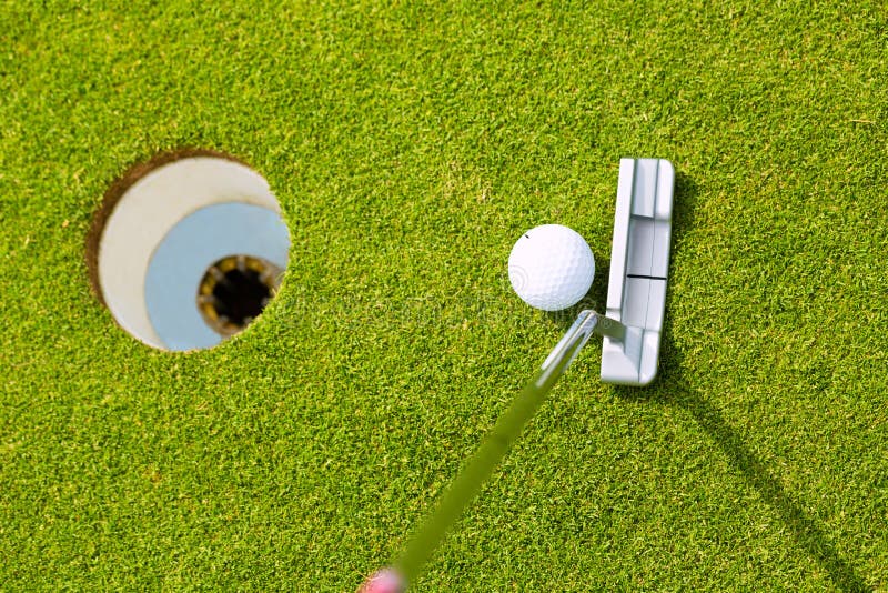 Golf Player Putting Ball in Hole Stock Image Image of cropped, feet