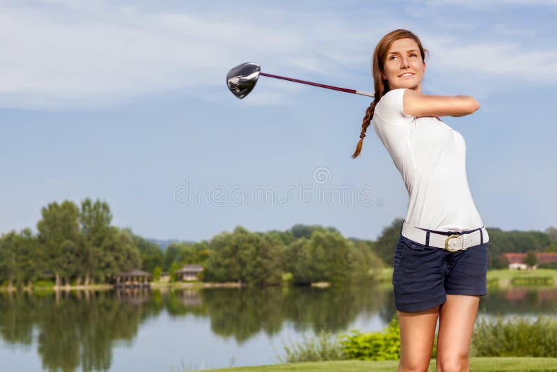 Golf player teeing off