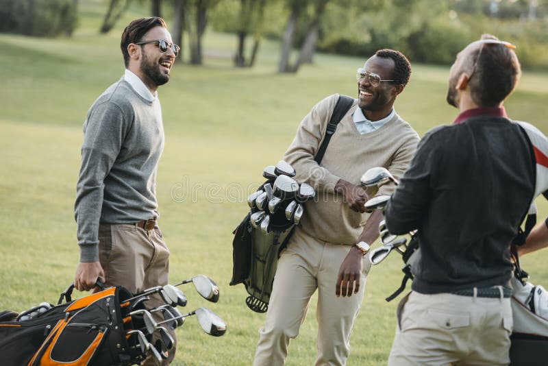Golf players with golf clubs having fun on golf course royalty free stock photos Golf players with golf clubs having fun on golf course royalty free stock photos